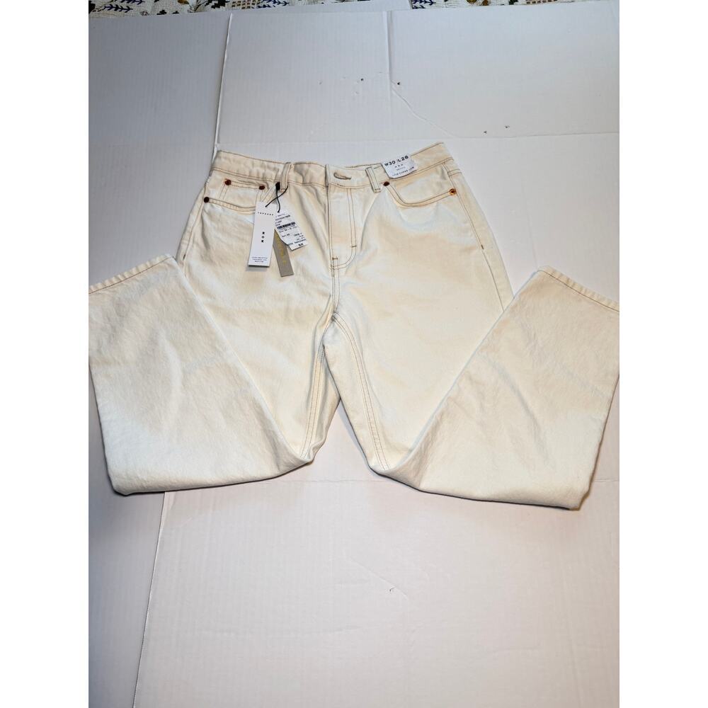 Topshop Mom jeans in white denim with a high-rise fit.